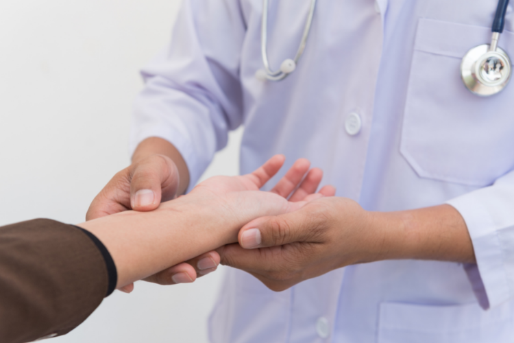Carpal Tunnel Syndrome Treatments Doctor assessing patient's wrist