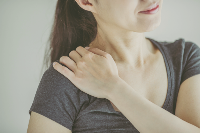 Rotator Cuff Calcific Tendonitis Causes Symptoms Treatment Woman holding shoulder in pain