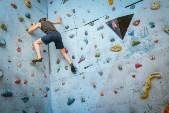 Woman on climbing wall