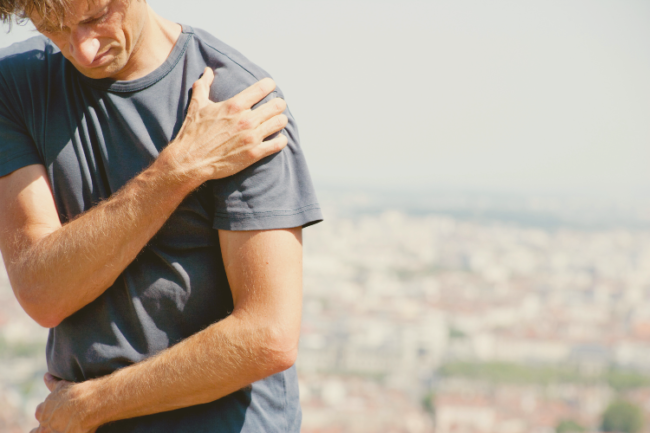 Proximal Humerus Fractures Man holding shoulder in pain