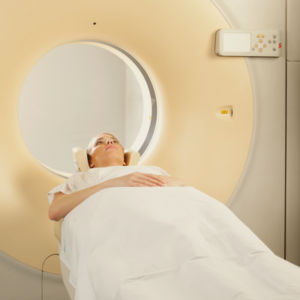 Woman having CT scan to diagnose shoulder dislocation