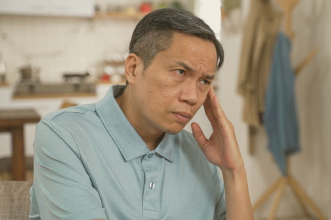 Shoulder surgery common patient fears Older man holding face looking concerned