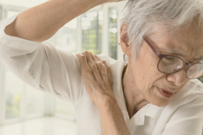 Shoulder Arthritis Keyhole Surgery Older woman holding shoulder in pain