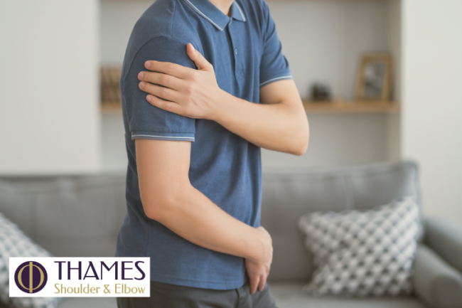 Bone Grafts for Broken Shoulder Man at home holding shoulder