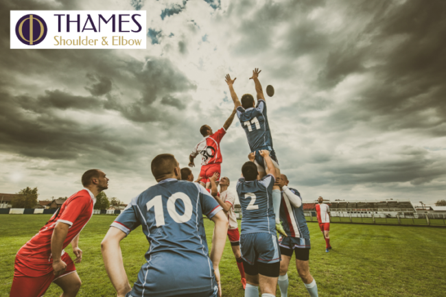 Rugby Players Avoid Shoulder Injuries Rugby team jumping up for ball on pitch